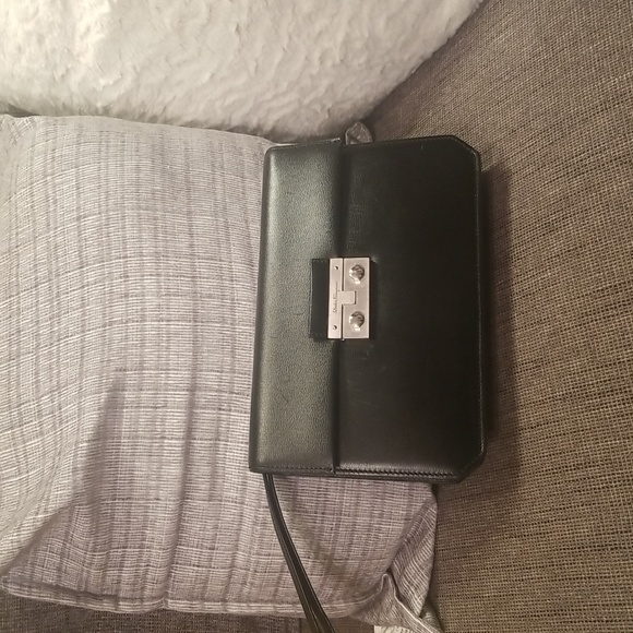 Salvatore Ferragamo Handbags - Salvatore Ferragamo Black Leather Clutch 10" X 7" With Slide Wrist Strap